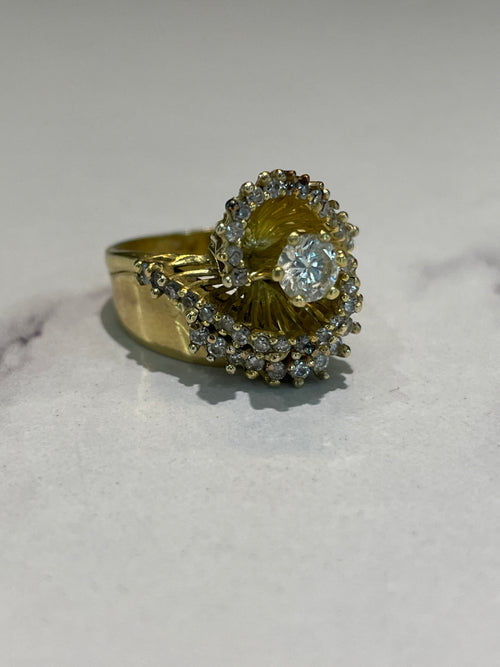 18 carat gold and diamond swirl design ring