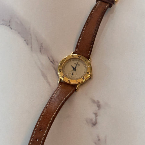 Gold Round Gucci Watch