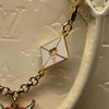 Louis Vuitton Alma Patent Leather Cream Bag With Charm