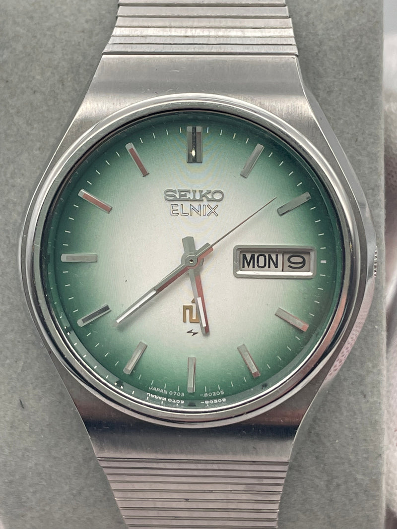 Seiko 0703-8040 Day Date Stainless Steel Elnix Mens Watch – Elite Seiko 0703-8040 Day Date Stainless Steel Elnix Mens Watch – Elite